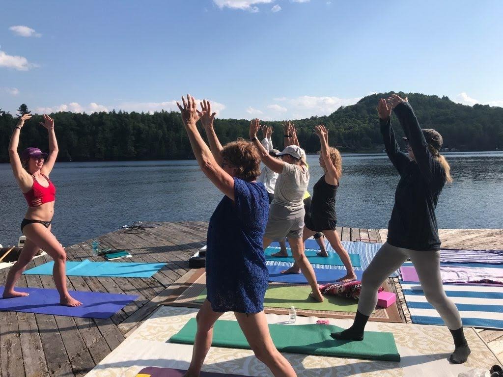 Example of group class, Sabrina teaching yoga on a dock